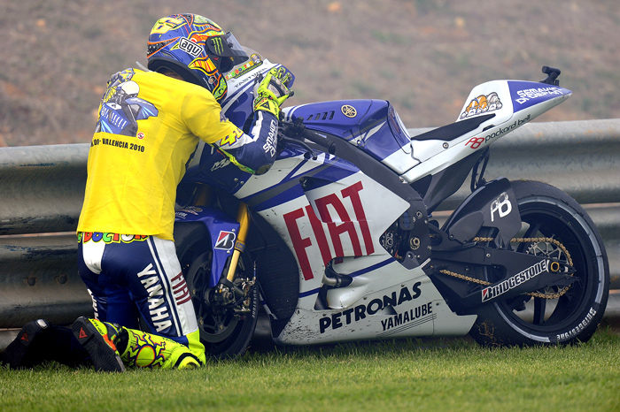 Valentino Rossi says goodbye to his Yamaha M1 motoGP bike at Valencia