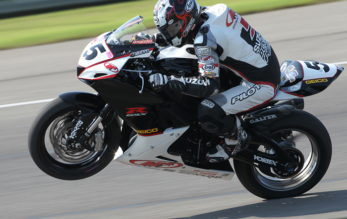 Casey Stoner, Jorge Silverstone  MotoGP action photo